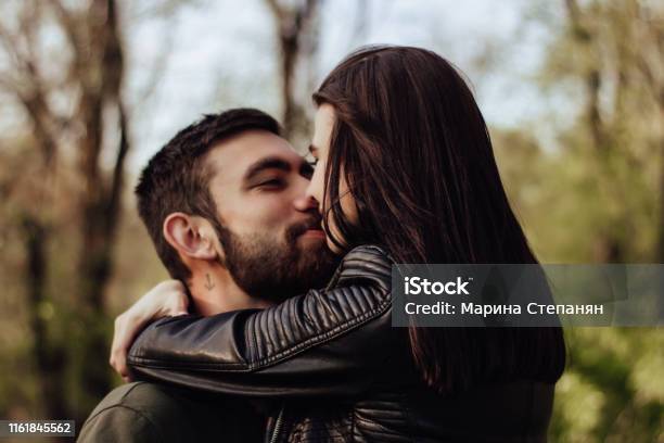 Head Shot Of Young Affectionate Romantic Couple In Love Close Up Portrait Of Attractive Brunette Girl And Guy With Eyes Closed Close To Each Other Concept Of First Kiss Tenderness And Amorousness Stock Photo - Download Image Now