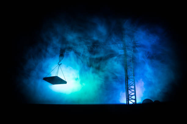 istock Abstract Industrial background with construction crane silhouette over amazing sunset sky. Tower crane against the evening sky. Industrial skyline 1161848457