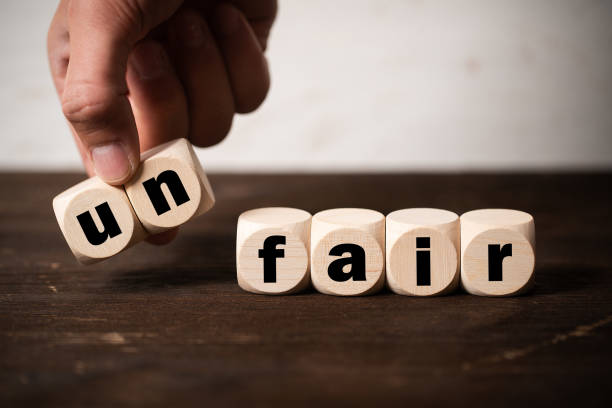 istock Removing two blocks with letters to change the word unfair to fair 1161848552