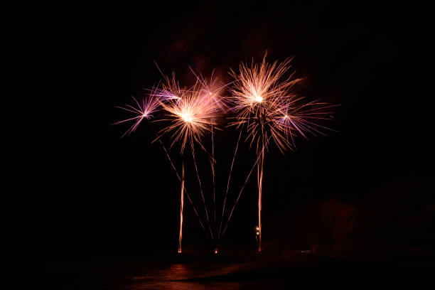 This photo was taken in France, north of Normandy, in Veules-les-Roses during the festivities of July 14. You can see the fireworks at the foot of the cliffs of the city.