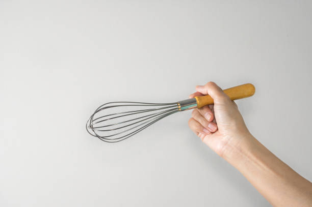 istock Woman holding whisk for beater. 1161854148
