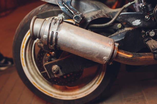 istock rear view of classical motorcycle pair of exhaust chrome pipes selective focus. 1161854749