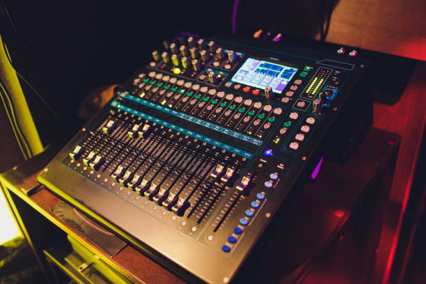 istock DJ turntable console mixer controlling with two hand in concert nightclub stage. 1161855027