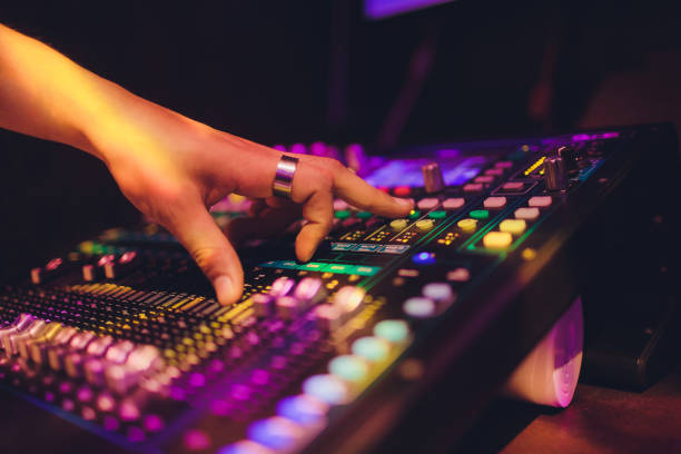 istock DJ turntable console mixer controlling with two hand in concert nightclub stage. 1161855037
