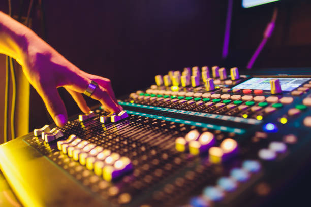 istock DJ turntable console mixer controlling with two hand in concert nightclub stage. 1161855041