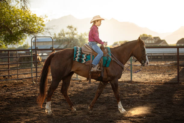 istock Cowgirl riding her horse 1161867611