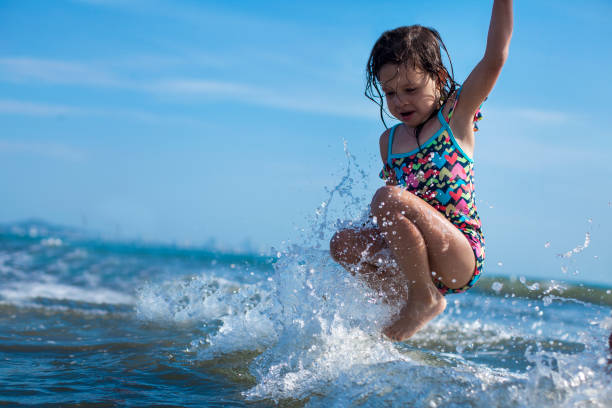 istock Little girl is exploring the beach 1161883523