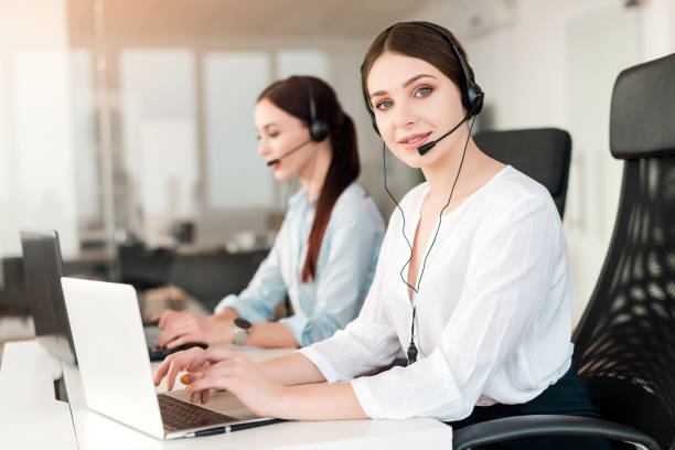 istock Call center operator answering clients in a company with tech support 1161883611