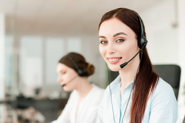 istock female call center dispatcher answering client calls via headset and online 1161883708