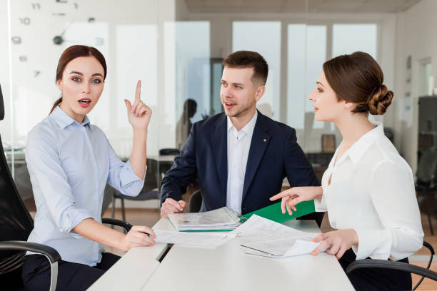 istock office workers discussing business strategy in a company 1161883764