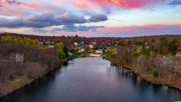 istock Dramatic sunset over a lake surrounded by colorful houses 1161883856