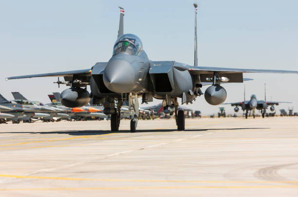 istock F-15C Eagle Fighter Jet taxiing on runway 1161886515