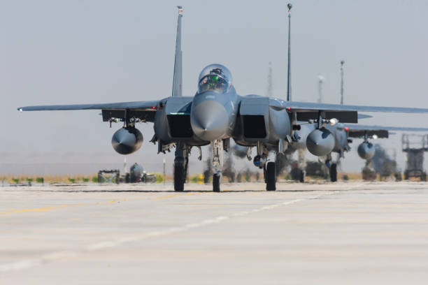 istock F-15C Eagle Fighter Jet taxiing on runway 1161886562