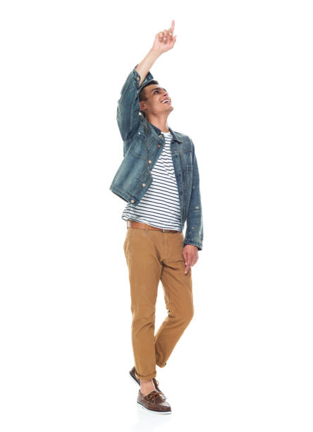 istock Good looking tall black man wearing denim jacket - pointing up 1161890119
