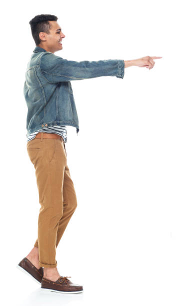 istock Good looking tall black man wearing denim jacket - pointing 1161890130