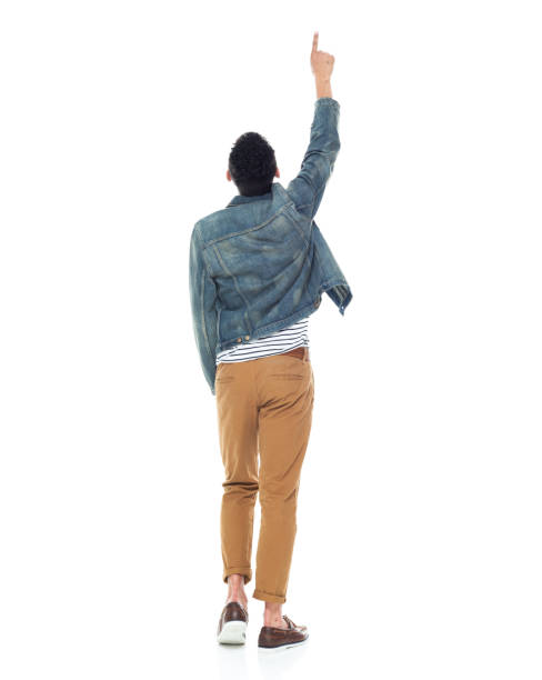 young asian man taking off sweater isolated on white background