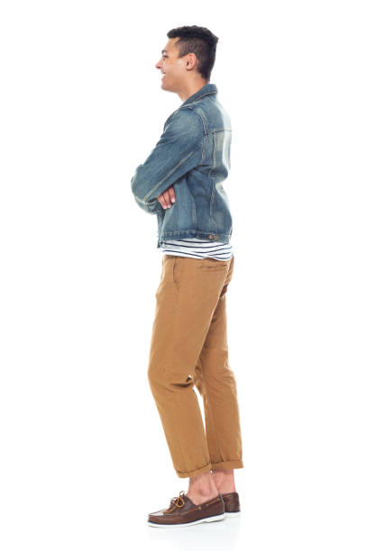 istock Good looking tall black man wearing denim jacket - arms crossed 1161890169
