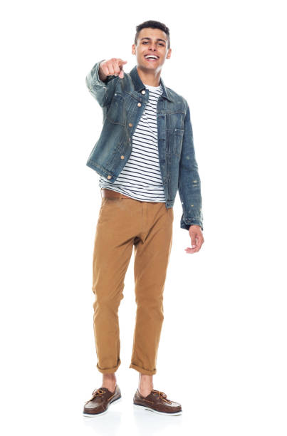 istock Good looking tall black man wearing denim jacket - pointing 1161890174