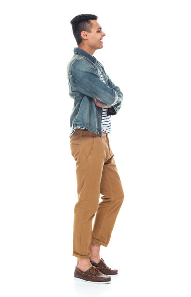 istock Good looking tall black man wearing denim jacket - arms crossed 1161890177