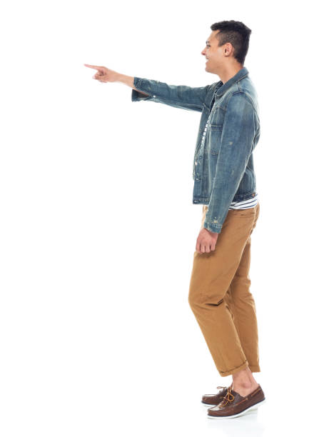 istock Good looking tall black man wearing denim jacket - pointing 1161890183