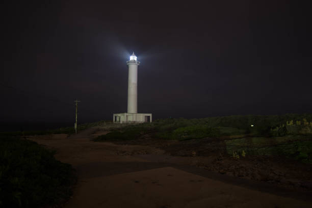 istock Lighthouse Near the Ocean during Night 1161891026
