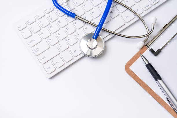 istock Medical Concept - Stethoscope on computer keyboard on white background. Physician long term care treatment concept. Top view, flat lay, copy space 1161891119