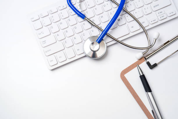 istock Medical Concept - Stethoscope on computer keyboard on white background. Physician long term care treatment concept. Top view, flat lay, copy space 1161891183