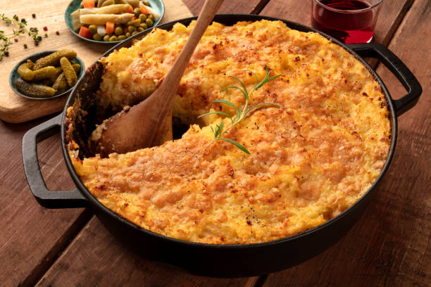 istock Homemade Shepherd's pie with pickles and wine on a rustic background 1161892258