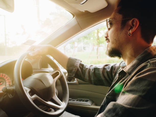 istock Hipster asian man going on a trip by car 1161893525