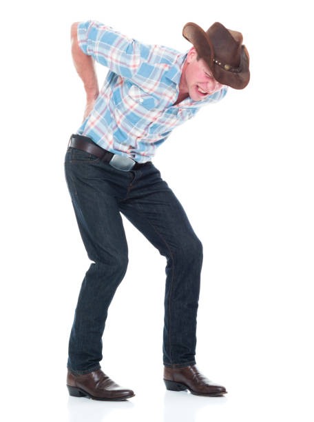 istock Handsome cowboy is having back pain 1161893534