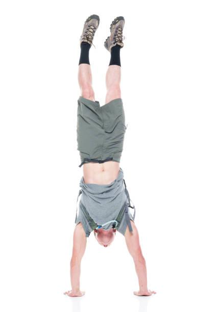 istock Friendly male hiker is doing a handstand 1161894345