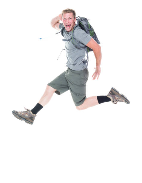 istock Friendly male hiker is jumping with excitement 1161894440