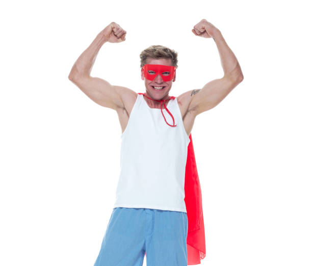 istock Man wearing pajamas and super hero cape 1161895616