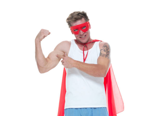 istock Man wearing pajamas and super hero cape 1161895641