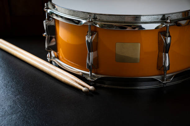 istock Drum stick and drum on black table background, close up for music concept 1161898794