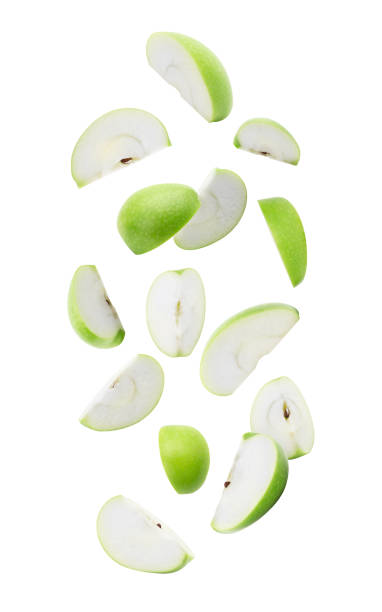 istock Slice ripe green apple falling isolated on white background with clipping path 1161901258