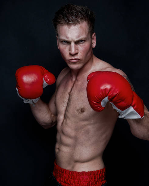 istock Sexy male boxer on black background 1161901963