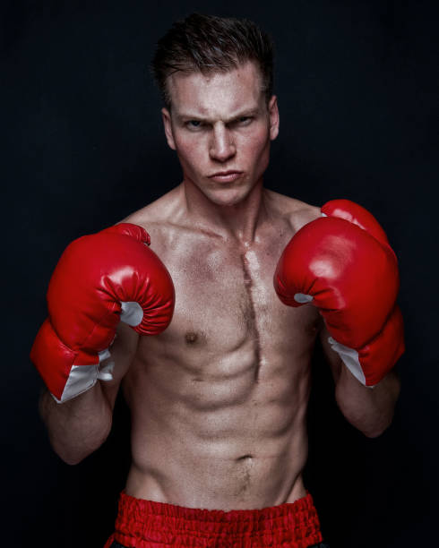 istock Sexy male boxer on black background 1161902633