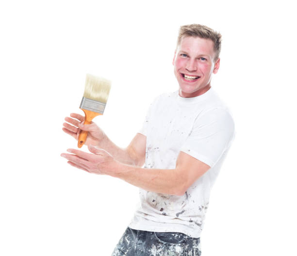 istock Handsome young male painter wearing staned clothes  on white background - clapping 1161902939