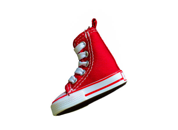 istock Key chain with mini red basketball shoe on white background 1161902965