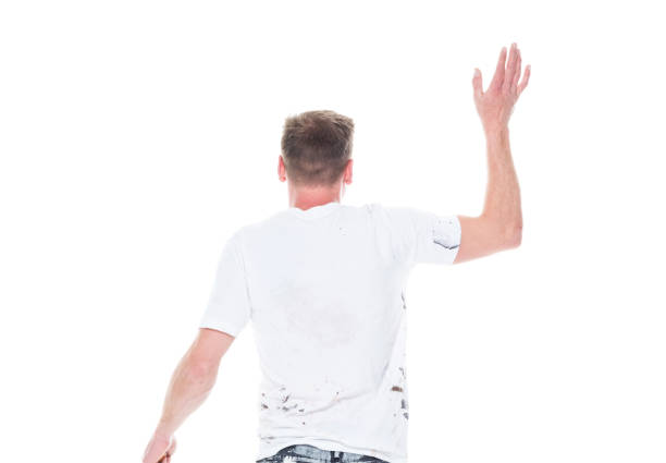 istock Good looking young male painter moving in action - walking and waving 1161903118