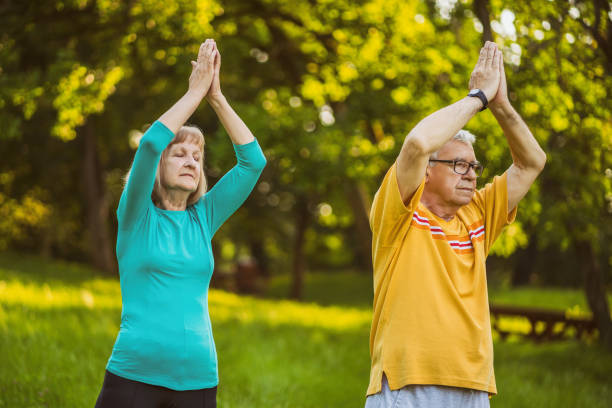 istock Senior couple meditating 1161904469