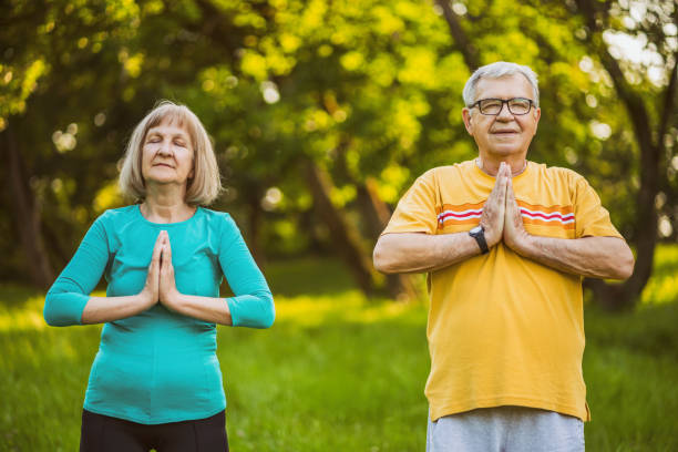 istock Senior couple meditating 1161905138
