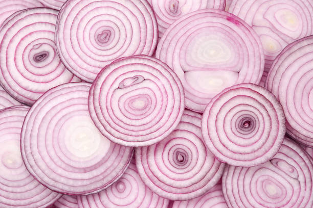istock Onion slices as a background. Top view. 1161905590