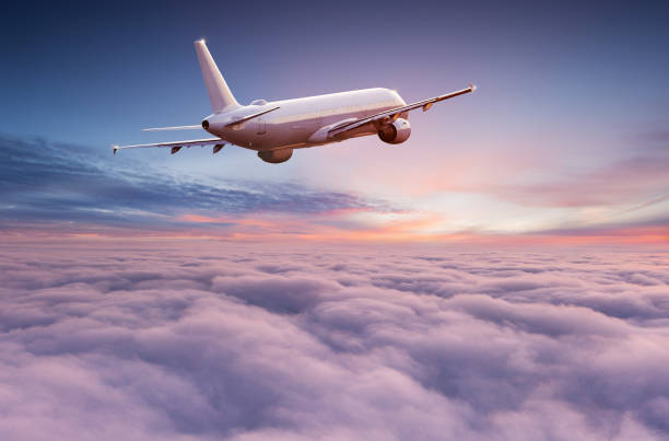 istock Commercial airplane jetliner flying above dramatic clouds. 1161909221