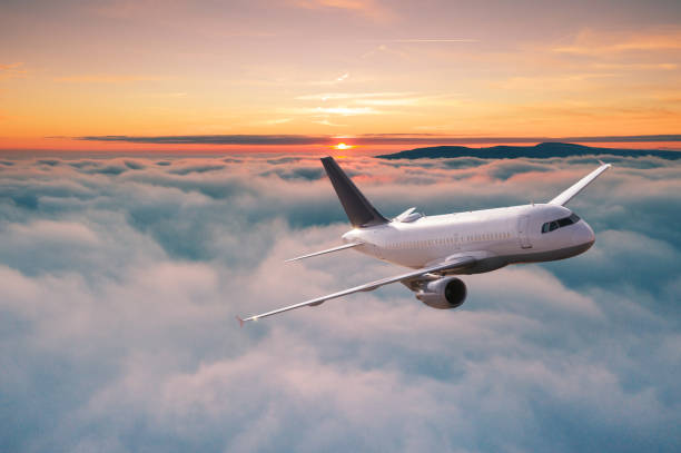istock Commercial airplane jetliner flying above dramatic clouds. 1161910195