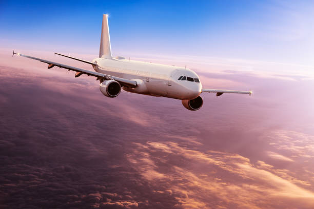 istock Commercial airplane jetliner flying above dramatic clouds. 1161910918