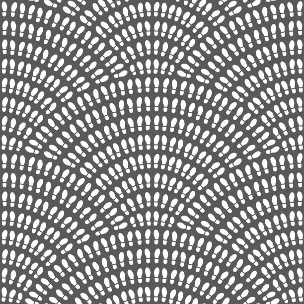 istock Multitude of white shoes foot imprint on a dark grey background.  Vector abstract seamless wavy pattern with geometrical fish scale layout. Population crowd meeting concept wallpaper print, web page fill 1161911194