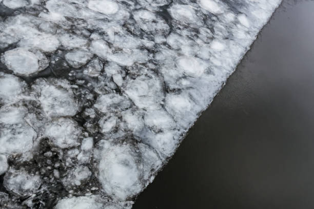 istock Flood in spring. Ice on half the river. Awakening of nature 1161912241