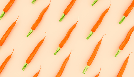carrots laid out in a row on a beige background, 3d illustration